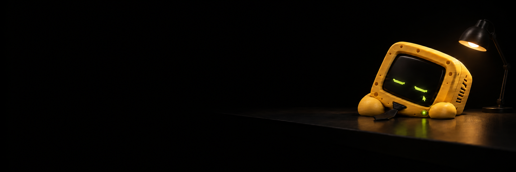 NOOP asleep on a desk beside a switchable lamp